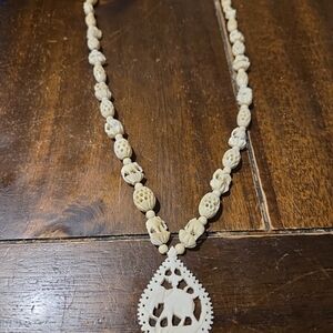 Elegant Cream Beaded Necklace with Elephant Pendant
